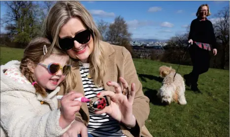  ?? Picture: Martin Shields ?? Emma Gilmartin and daughter Millie, 4, from Glasgow, enjoy the fresh air in the city, as a new research project by the University of Glasgow exploring walking and creativity during the pandemic was launched. Professor Deirdre Heddon, pictured with her dog Rafa, leads the project