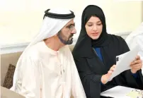  ?? Wam photos ?? Sheikh Mohammed with Reem Al Hashemy during his visit to the the Dubai Expo site office on Monday.—