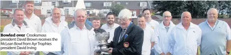  ??  ?? Bowled over Crooksmoss president David Brown receives the McLean Bowl from Ayr Trophies president David Irving