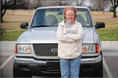  ?? CHARLIE RIEDEL/AP PHOTO ?? Carol Rice stands with her recently-purchased 2003 Ford Ranger Wednesday in Shawnee, Kan. Rice’s timing to buy the truck was ideal, taking advantage of a recent dip in used car prices which now appear to be heading back up.
