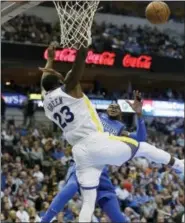  ?? LM OTERO — THE ASSOCIATED PRESS ?? Golden State Warriors forward Draymond Green (23) stops Dallas Mavericks forward Nerlens Noel (3) from scoring during Monday’s game in Dallas.