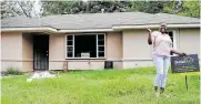  ??  ?? Crystal Wicks celebrates the renovation of her home by BuildAid after Hurricane Harvey flooded it.