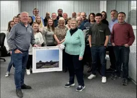  ?? ?? Jackie Godwin receives a signed picture from her brother Terry Smith, surrounded by Arena colleagues past and present