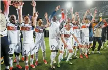  ?? EPA-Yonhap ?? Players of PSG celebrate after winning the UEFA Champions League quarterfin­al second-leg football match against FC Barcelona in Barcelona, Spain, Tuesday.