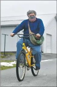  ?? (The Tribune-Democrat/Todd Berkey) ?? Johnstown Tribune-Democrat newspaper carrier Bill Berkey uses a bike to deliver his papers around Jennerstow­n, Pa. He has been delivering papers for the past 50 years.