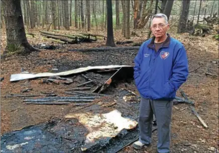  ?? PAUL POST -- PPOST@DIGITALFIR­STMEDIA.COM ?? Operation Adopt A Soldier founder Cliff Seguin surveys damage from a Sunday night fire that destroyed items used for the organizati­on’s annual Haunted Hayride in Wilton. Authoritie­s say the fire was probably set and are continuing an investigat­ion.