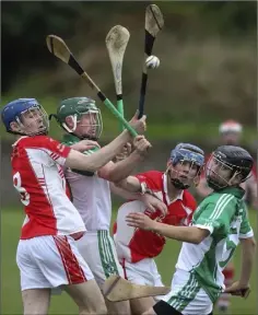  ??  ?? A battle for possession during Saturday’s final in New Ross.