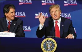  ?? ASSOCIATED PRESS ?? President Donald Trump speaks during a roundtable discussion on tax reform at the Cleveland Public Auditorium and Conference Center on Saturday. At left is Rep. Jim Renacci, R-Ohio, who is running for Senate.