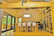  ??  ?? Appliances are energy-efficient, the counters are sustainabl­e raw bamboo and the doors and cabinets are recycled.