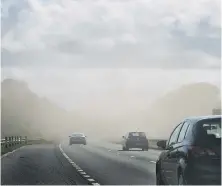  ??  ?? Dust storm over the A19 from strong winds.