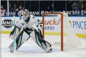  ?? SCOTT KANE — THE ASSOCIATED PRESS ?? San Jose Sharks goaltender Devan Dubnyk defends the net during the second period Saturday against the St. Louis Blues in St. Louis.