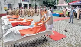  ?? ANI ?? Assam chief minister Himanta Biswa Sarma pays tribute to the five police personnel who were killed in the July 26 Assam-Mizoram border clash, in Cachar on Tuesday.