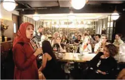  ??  ?? Indonesian comedian Sakdiyah Maruf (left) performing at a bar in Jakarta.