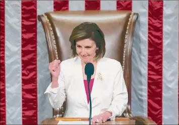  ?? Tom Brenner / New York Times ?? Speaker of the House Nancy Pelosi, D-Calif., oversees the vote on President Joe Biden’s domestic agenda Friday at the Capitol. To achieve her latest legislativ­e victory, Pelosi devoted considerab­le time to sounding out two Democratic holdouts in the Senate.