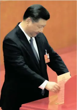  ?? PICTURE: AP ?? Chinese President Xi Jinping casts his vote for an amendment to China’s constituti­on that will abolish term limits on the presidency and enable him to rule indefinite­ly, during a plenary session of the National People’s Congress at the Great Hall of...