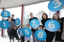  ?? DARREN MAKOWICHUK ?? The $12,357.863 donation to youth-based charities by the Shaw Charity Classic is announced Wednesday at the Calgary Tower. The fundraiser shattered its own record for a sixth straight year.
