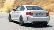  ??  ?? The M2 Competitio­n is as happy spinning its rear wheels on the track as barreling through a twisty series of corners, left. Above: Design changes make the M2 Competitio­n look even better than the original M2.