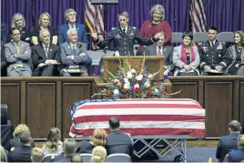  ?? AP ?? SALUTING A SOLDIER: Capt. Derek Taylor, brother of Maj. Brent R. Taylor, speaks about his brother during funeral services at Weber State University’s Dee Event Center in Ogden, Utah, yesterday. Taylor, 39, the mayor of North Ogden, died Nov. 3 while serving in Afghanista­n.