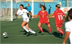  ??  ?? Palestinia­n female football players (in red) are seen during a qualifying match.