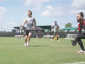  ?? Courtesy of San Jose Earthquake­s ?? Quakes players, including Jackson Yueill, Chris Wondolowsk­i and goalkeeper Matt Bersano, train in Orlando, where San Jose has been since June 24.