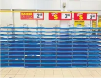  ?? JOHN MAHONEY ?? The bread shelves were empty at the Maxi store in Pointe-claire on Friday as shoppers stocked up on grocery items.