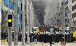  ?? ?? Police move in to clear a demonstrat­ion of farmers near the European Council building in Brussels, Tuesday, March 26, 2024.