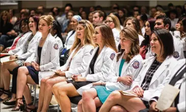  ?? ACC ?? Nursing students at Austin Community College attend a ceremony last month at ACC’s Eastview Campus in which they received their pins for successful­ly completing two-year associate degrees.