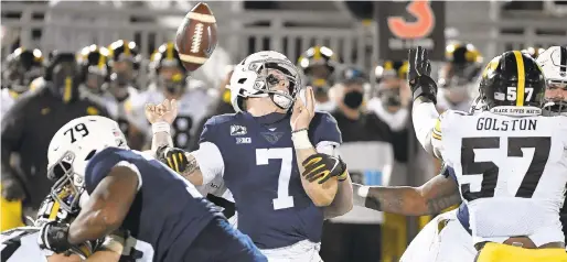  ?? BARRYREEGE­R/AP ?? Penn State quarterbac­k Will Levis (7) fumbles the ball while being hit by Iowa linebacker Jack Campbell (31) during the third quarter of Saturday’s game in State College. Iowa defeated Penn State 41-21.