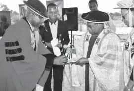  ??  ?? Prof. Suleiman Garba (left) presents his inaugural lecture pamphlet to Vice Chancellor of National Open University of Nigeria Prof. Abdalla Uba Adamu while the Registrar Mrs Josephine Akinyemi (Right) looks on in Abuja, Tuesday