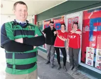  ?? PHOTO: DANIEL BIRCHFIELD ?? Rival colours . . . Maheno rugby player and Kurow resident Andrew Fisher is goaded by Kurow supporters (from left) Richard Aarts, Caroline Hayes and Carol Harding in the town’s main street yesterday ahead of the Citizens Shield rugby semifinal between...