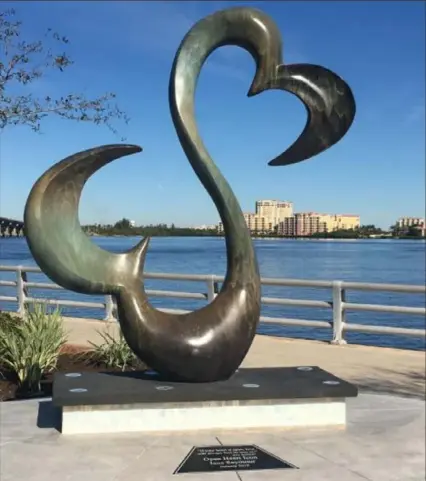  ?? Realize Bradenton ?? This 7-foot bronze sculpture was created by actor and artist Jane Seymour. The sculpture, with two hearts linked together symbolizes the philosophy that “if your heart is open, love will find its way in.” The sculpture is located along the Riverwalk near Manatee Memorial Hospital in Bradenton, Fla.