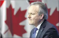  ?? AP PHOTO ?? Stephen Poloz, Governor of the Bank of Canada, holds a press conference at the Bank of Canada in Ottawa on Wednesday. Bankruptci­es are up in Canada, the head of the Bank of Canada said this week, and he expects they’ll rise even more as the central bank continues to hike interest rates.