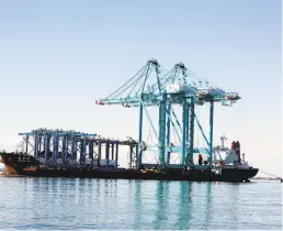  ?? BILL TIERNAN/FREELANCE ?? Two new container cranes arrive Friday afternoon at Norfolk Internatio­nal Terminals aboard the Zhen Hua 24.