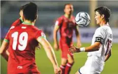  ?? AFP ?? ■ Phil Younghusba­nd (right) of the Philippine­s controls the ball against Tajikistan during the qualifier in Manila.