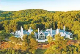 ?? FILE PHOTO BY JESSE HUNTER / @TEAMMEDIAS­ERVICES ?? The Mills home on Skillet Gap Road sold for more than $4.6 million.