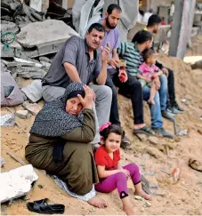  ?? Reuter/Mohammed Salem ?? A Palestinia­n woman reacts after returning to her destroyed house following Israel- Hamas truce, in Beit Hanoun in the northern Gaza Strip, May 21, 2021.