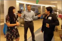  ?? ANNA GORMAN, TNS ?? Neonatolog­ist Joanna Parga, left, pediatric cardiologi­st Mark Sklansky and nurse Anahit Sarin-Gulian don’t shake hands anymore with anyone at work. Sklansky proposed handshake-free zones at UCLA hospitals to reduce the spread of germs and serious...