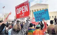  ?? OLIVIER DOULIERY/ABACA PRESS/TNS ?? Protesters gather in front of the Supreme Court building on the day the court is to hear the case Masterpiec­e Cakeshop v. Colorado Civil Rights Commission on Tuesday, Dec. 5, 2017 in Washington, D.C.