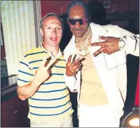  ?? [PROVIDED] ?? Cleveland County District Judge Thad Balkman and rapper Snoop Dogg pose for a photo at their 30th high school class reunion after-party Saturday in Los Angeles.