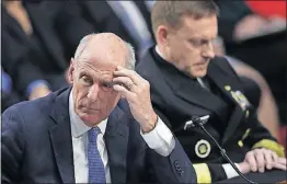  ?? [CAROLYN KASTER/THE ASSOCIATED PRESS] ?? National intelligen­ce director Dan Coats, left, and National Security Agency director Adm. Mike Rogers pause during Wednesday’s contentiou­s Senate Intelligen­ce Committee hearing.