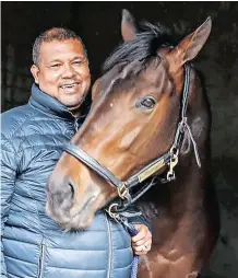  ??  ?? THAT winning feeling. Ashwin Reynolds, owner of Kommetdied­ing, with the winning horse in the 2021 Vodacom Durban July.