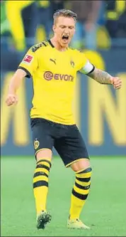  ??  ?? Borussia Dortmund's Marco Reus celebrates the win over Borussia Dortmund on Saturday. REUTERS