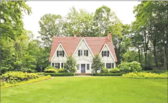  ?? Contribute­d photos ?? The French Normandy Tudor house at 1060 Hillside Road is affectiona­tely known in the Greenfield Hill neighborho­od as The Gingerbrea­d House.