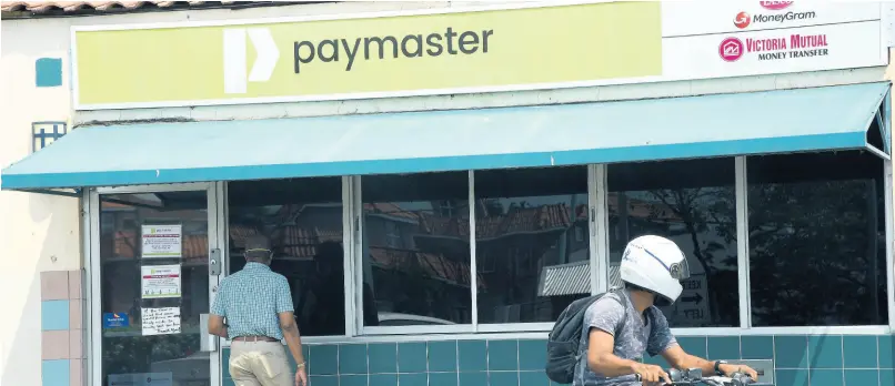  ?? FILE ?? A Paymaster outlet is pictured on March 26, 2020.