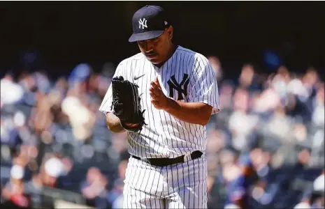  ?? Dustin Satloff / Getty Images ?? Yankees pitcher Nestor Cortes claps as he walks back to the dugout after the top of the seventh inning on Monday against the Rangers.