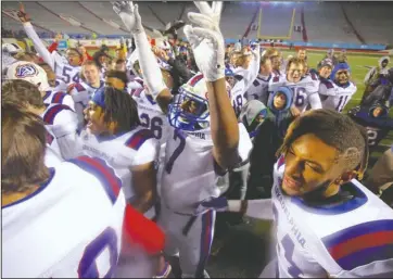  ?? Arkansas Democrat-Gazette/Thomas Metthe ?? REPEAT CHAMPIONS: Arkadelphi­a junior lineman Sammy Hawthorne (7) and senior running back Zion Hatley (24) celebrate with the rest of the Badgers after a 28-0 win Saturday over Joe T. Robinson in the Class 4A state championsh­ip game at War Memorial Stadium in Little Rock.