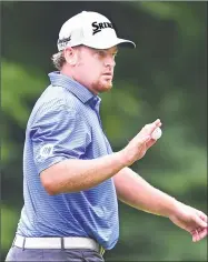  ?? Catherine Avalone / Hearst Connecticu­t Media ?? JB Holmes gestures to the crowd after making an eagle from the fairway on the 14th hole Saturday.