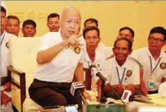  ?? HENG CHIVOAN ?? Funcinpec leader Prince Norodom Ranariddh speaks at a party congress last month. Funcinpec stands to benefit the most from controvers­ial proposed changes to the Kingdom’s election laws.