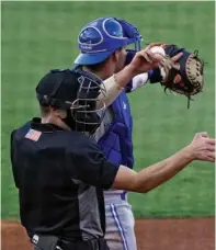  ?? The Associated Press ?? ■ Home plate umpire Kaleb Devier calls a strike during a Low A Southeast League game between the Dunedin Blue Jays and the Tampa Tarpons at George M. Steinbrenn­er Field Tuesday in Tampa, Fla. The game is one of the first in the league to use automatic balls and strike calls.