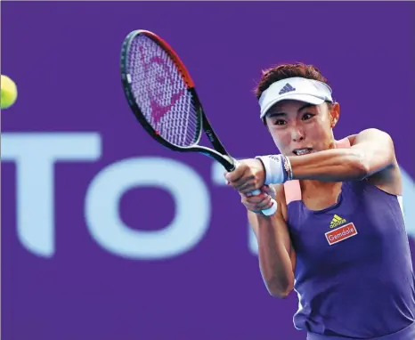  ?? GETTY IMAGES ?? Wang Qiang, pictured in action in Qatar in February during her last tournament before the WTA Tour’s suspension, says she is using the sport’s shutdown to recharge, mentally and physically.